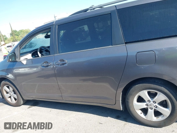 2014 Toyota Sienna LE AAS with VIN 5TDKK3DC6ES521706, listed as a IAAI auction lot 41999188 with 104,867 mi miles. Bid and sale history available at carsss.com. Image 14.