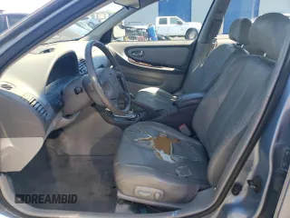 2000 Nissan Maxima GXE z VIN JN1CA31D9YT543874, wystawiony jako Copart lot #69275784 z przebiegiem 214 833 mil mil oraz Szkoda całkowita • Salvage title. Historia ofert i sprzedaży dostępna na DreamBid. Obrazek 7.