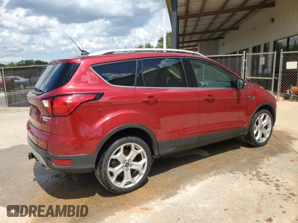 2019 Ford Escape Titanium z VIN 1FMCU0J97KUB20612, wystawiony jako Copart lot #64638415 z przebiegiem 100 102 mil mil oraz Czysty tytuł • Clean title. Historia ofert i sprzedaży dostępna na DreamBid. Obrazek 3.