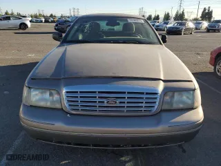 2005 Ford Crown Victoria LX with VIN 2FAFP74W75X129929, listed as a Copart auction lot 89020125 with 156,115 mi miles and Salvage Title. Bid and sale history available at carsss.com. Image 5.