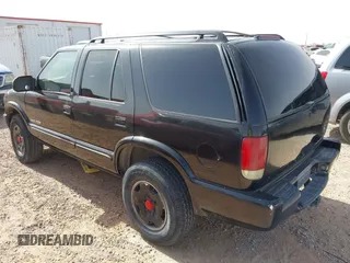 2002 Chevrolet Blazer LS z VIN 1GNDT13W42K124494, wystawiony jako IAAI lot #42266284 z przebiegiem 259 857 mil mil oraz . Historia ofert i sprzedaży dostępna na DreamBid. Obrazek 3.