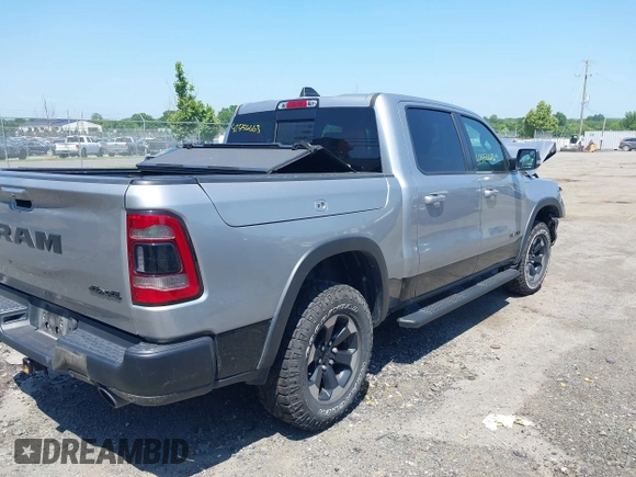 2019 Ram 1500 Rebel with VIN 1C6SRFLT8KN797618, listed as a IAAI auction lot 42556663 with 92,606 mi miles and . Bid and sale history available at DreamBid. Image 4.