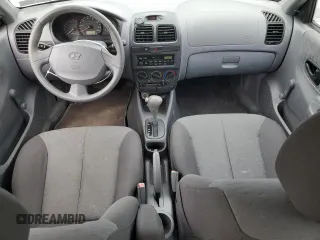 2004 Hyundai Accent GL with VIN KMHCG45C94U515186, listed as a Copart auction lot 52697284 with 49,236 mi miles and Salvage Title. Bid and sale history available at carsss.com. Image 8.