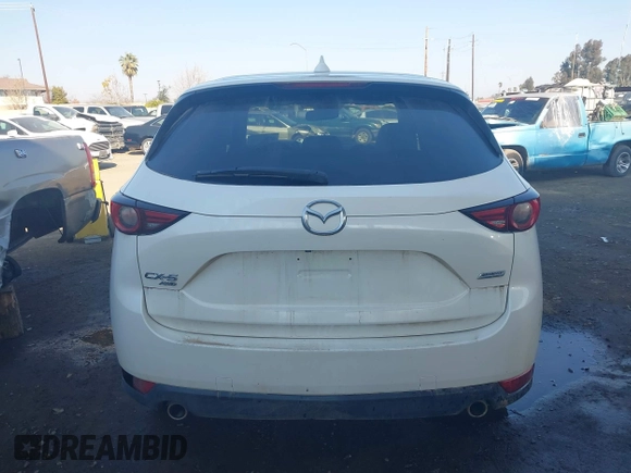 2017 Mazda CX-5 Grand Touring with VIN JM3KFBDL6H0164993, listed as a IAAI auction lot 41450556 with 97,733 mi miles. Bid and sale history available at carsss.com. Image 16.