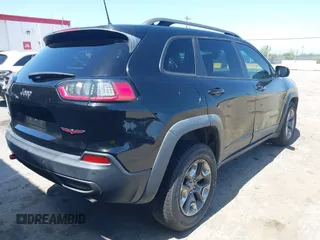 2019 Jeep Cherokee Trailhawk Elite with VIN 1C4PJMBX0KD198328, listed as a IAAI auction lot 42085194 with 76,312 mi miles and . Bid and sale history available at DreamBid. Image 4.
