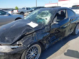 2014 BMW 2 Series M235i with VIN WBA1J7C50EVX33903, listed as a IAAI auction lot 40207684 with 81,766 mi miles and . Bid and sale history available at DreamBid. Image 6.