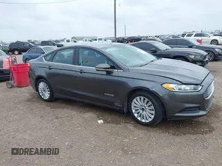 2016 Ford Fusion SE Hybrid with VIN 3FA6P0LU5GR235241, listed as a IAAI auction lot 41697504 with 165,510 mi miles. Bid and sale history available at carsss.com. Image 1.
