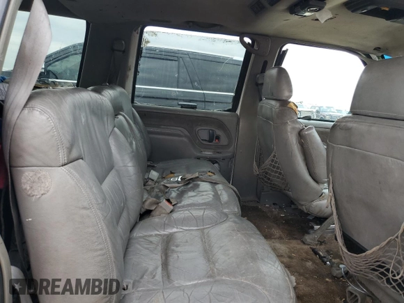 1999 Chevrolet Suburban with VIN 1GNEC16R7XJ418169, listed as a Copart auction lot 88995495 with 2,015,240 mi miles and Salvage title. Bid and sale history available at DreamBid. Image 11.