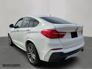 2018 BMW X4 M40i with VIN 5UXXW7C53J0W65097, listed as a Copart auction lot 54391035 with 133,367 mi miles and Clean Title. Bid and sale history available at carsss.com. Image 3.