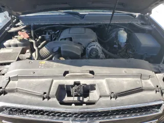2014 Chevrolet Suburban LT with VIN 1GNSKJE71ER227075, listed as a Copart auction lot 76675654 with 214,113 mi miles and Salvage Title. Bid and sale history available at DreamBid. Image 12.