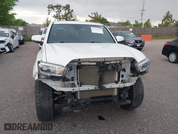 2020 Toyota Tacoma SR5 z VIN 5TFCZ5AN5LX242708, wystawiony jako IAAI lot #42356772 z przebiegiem 65 442 mil mil oraz . Historia ofert i sprzedaży dostępna na DreamBid. Obrazek 6.