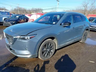 2021 Mazda CX-9 Grand Touring with VIN JM3TCBDY5M0506632, listed as a IAAI auction lot 41589264 with 50,026 mi miles and . Bid and sale history available at carsss.com. Image 2.