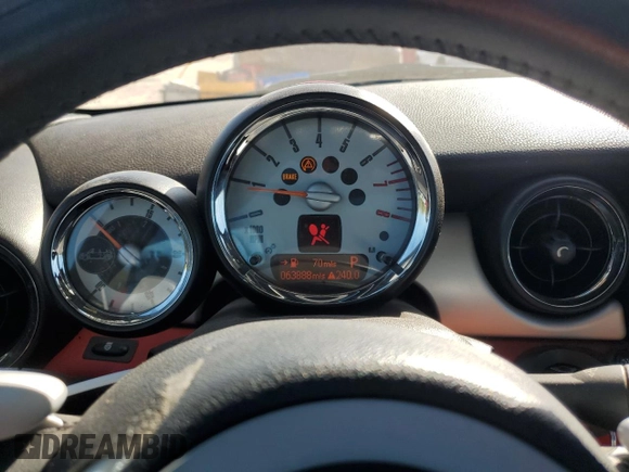 2009 MINI Convertible z VIN WMWMR335X9TU95073, wystawiony jako Copart lot #73690884 z przebiegiem 63 888 mil mil oraz Szkoda całkowita • Salvage title. Historia ofert i sprzedaży dostępna na DreamBid. Obrazek 9.