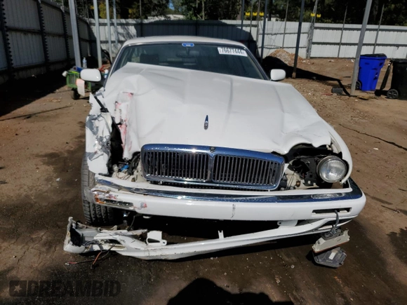1996 Jaguar XJ with VIN SAJHX1747TC767829, listed as a Copart auction lot 76677444 with Not provided miles and Salvage title. Bid and sale history available at DreamBid. Image 5.