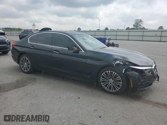 2018 BMW 5 Series 540i with VIN WBAJE5C54JWA93338, listed as a Copart auction lot 54312385 with 77,537 mi miles and Salvage title. Bid and sale history available at DreamBid. Image 4.