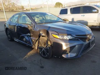 2019 Toyota Camry LE z VIN 4T1B11HK1KU757269, wystawiony jako IAAI lot #41354042 z przebiegiem 60 652 mil mil oraz . Historia ofert i sprzedaży dostępna na DreamBid. Obrazek 1.