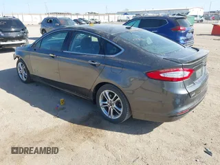 2016 Ford Fusion Titanium Hybrid с VIN 3FA6P0RU8GR266488, выставлен на аукционе IAAI как лот 41903919 с пробегом 74 927 миль миль и . История ставок и продаж доступна на DreamBid. Изображение 3.