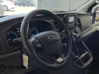 2020 Ford Transit Cargo z VIN 1FTBR1XG3LKB79165, wystawiony jako IAAI lot #42763042 z przebiegiem 140 992 mil mil oraz . Historia ofert i sprzedaży dostępna na DreamBid. Obrazek 36.