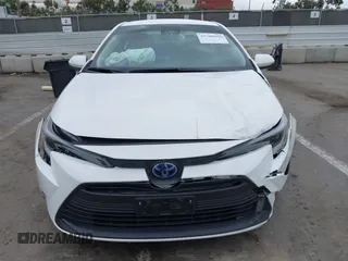 2023 Toyota Corolla Hybrid LE with VIN JTDBCMFE3PJ010097, listed as a IAAI auction lot 41786656 with 50,775 mi miles. Bid and sale history available at carsss.com. Image 12.