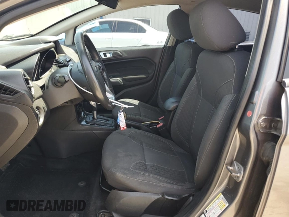 2014 Ford Fiesta SE z VIN 3FADP4BJ4EM110277, wystawiony jako Copart lot #56921115 z przebiegiem 126 536 mil mil oraz Szkoda całkowita • Salvage title. Historia ofert i sprzedaży dostępna na DreamBid. Obrazek 7.