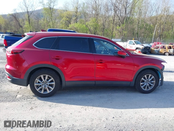 2019 Mazda CX-9 Touring with VIN JM3TCACY0K0310851, listed as a IAAI auction lot 42066395 with 91,046 mi miles and . Bid and sale history available at DreamBid. Image 14.