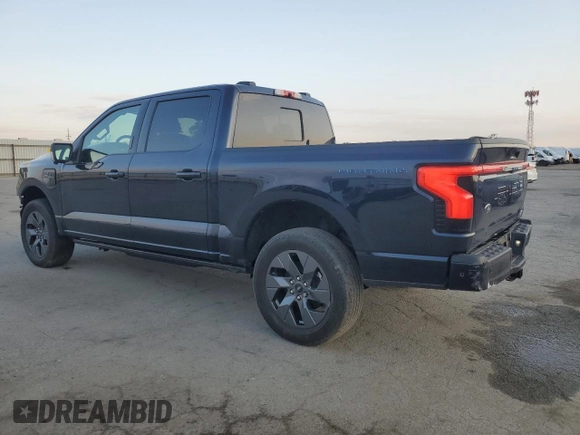 2023 Ford F-150 Lightning Pro with VIN 1FTVW1EV1PWG16263, listed as a Copart auction lot 54439535 with 12,023 mi miles and Salvage Title. Bid and sale history available at DreamBid. Image 2.