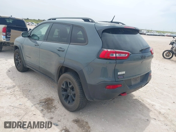 2015 Jeep Cherokee Trailhawk with VIN 1C4PJMBS0FW524479, listed as a IAAI auction lot 41908871 with 118,825 mi miles and . Bid and sale history available at DreamBid. Image 3.