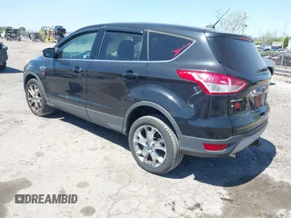2013 Ford Escape SEL with VIN 1FMCU9H97DUA51529, listed as a IAAI auction lot 42164245 with 106,649 mi miles and . Bid and sale history available at DreamBid. Image 3.