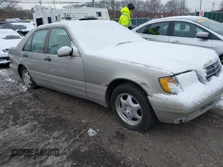1997 Mercedes-Benz S-Class with VIN WDBGA32GXVA344670, listed as a IAAI auction lot 41332847 with 999,999 mi miles. Bid and sale history available at carsss.com. Image 1.
