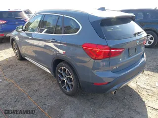 2021 BMW X1 xDrive28i with VIN WBXJG9C07M5T23053, listed as a IAAI auction lot 41774663 with 66,770 mi miles. Bid and sale history available at carsss.com. Image 3.