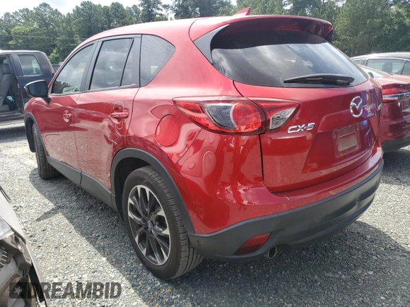 2016 Mazda CX-5 Grand Touring z VIN JM3KE2DY0G0722334, wystawiony jako Copart lot #59998185 z przebiegiem 51 449 mil mil oraz Szkoda całkowita • Salvage title. Historia ofert i sprzedaży dostępna na DreamBid. Obrazek 2.