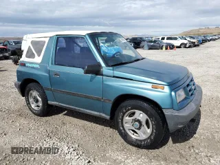 1996 Chevrolet Tracker z VIN 2CNBJ1869T6903615, wystawiony jako Copart lot #49690055 z przebiegiem 144 821 mil mil oraz Szkoda całkowita • Salvage title. Historia ofert i sprzedaży dostępna na DreamBid. Obrazek 4.