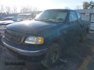 1999 Ford F-150 z VIN 1FTRX18W7XNA40655, wystawiony jako IAAI lot #41445754 z przebiegiem 362 296 mil mil oraz . Historia ofert i sprzedaży dostępna na DreamBid. Obrazek 2.