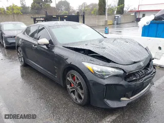 2018 Kia Stinger GT1 with VIN KNAE45LC4J6035780, listed as a IAAI auction lot 41560394 with 86,312 mi miles. Bid and sale history available at carsss.com. Image 1.