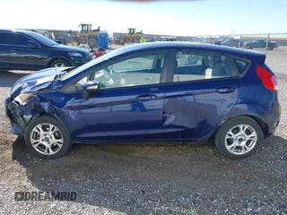 2016 Ford Fiesta SE z VIN 3FADP4EJ8GM150098, wystawiony jako IAAI lot #41890402 z przebiegiem 126 492 mil mil oraz . Historia ofert i sprzedaży dostępna na DreamBid. Obrazek 14.