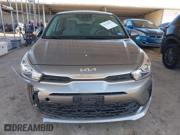 2023 Kia Rio S z VIN 3KPA24AD1PE579816, wystawiony jako IAAI lot #41349202 z przebiegiem 5784 mil mil oraz . Historia ofert i sprzedaży dostępna na DreamBid. Obrazek 12.