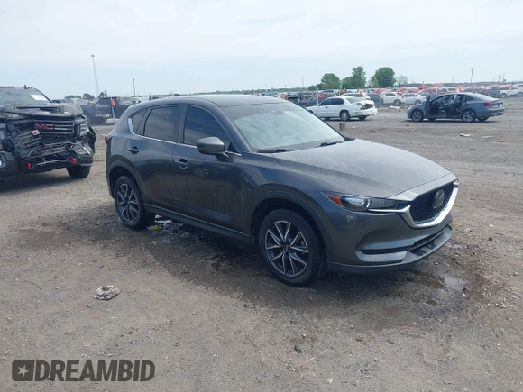 2018 Mazda CX-5 Touring with VIN JM3KFACM9J1348054, listed as a IAAI auction lot 42043458 with 120,177 mi miles. Bid and sale history available at carsss.com. Image 1.