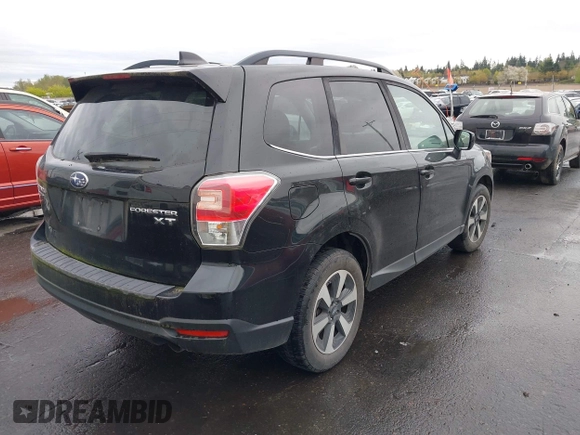 2018 Subaru Forester Premium with VIN JF2SJGEC4JH581718, listed as a IAAI auction lot 41988454 with 76,376 mi miles. Bid and sale history available at carsss.com. Image 4.