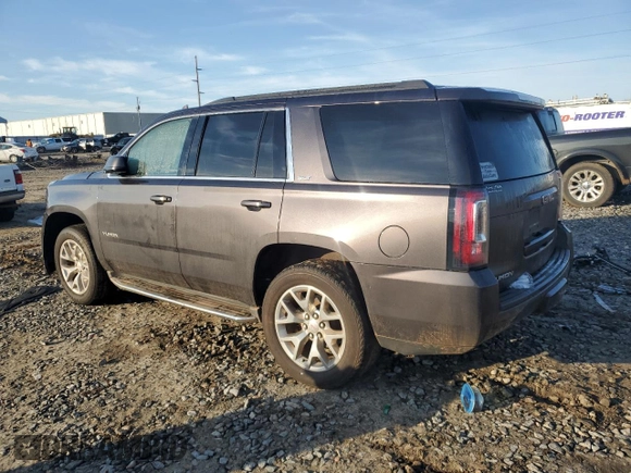 2015 GMC Yukon SLT with VIN 1GKS1BKC0FR735059, listed as a Copart auction lot 42960685 with 242,220 mi miles and Salvage Title. Bid and sale history available at carsss.com. Image 2.
