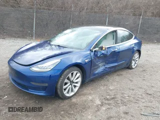 2020 Tesla Model 3 Long Range with VIN 5YJ3E1EB9LF601198, listed as a IAAI auction lot 41744287 with 70,322 mi miles and . Bid and sale history available at DreamBid. Image 2.