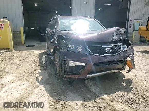2012 Kia Sorento SX z VIN 5XYKWDA29CG301363, wystawiony jako Copart lot #55954815 z przebiegiem 83 206 mil mil oraz Szkoda całkowita • Salvage title. Historia ofert i sprzedaży dostępna na DreamBid. Obrazek 14.