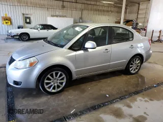 2011 Suzuki SX4 LE with VIN JS2YC5A24B6300735, listed as a Copart auction lot 77143914 with 69,338 mi miles and Salvage Title. Bid and sale history available at carsss.com. Image 1.