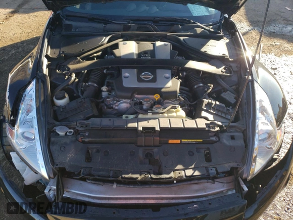 2014 Nissan 370Z Nismo z VIN JN1AZ4EHXEM632166, wystawiony jako Copart lot #88311915 z przebiegiem 18 414 mil mil oraz Szkoda całkowita • Salvage title. Historia ofert i sprzedaży dostępna na DreamBid. Obrazek 11.