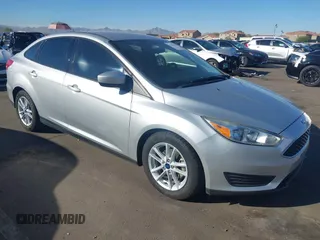 2018 Ford Focus SE z VIN 1FADP3F27JL204873, wystawiony jako IAAI lot #41657504 z przebiegiem 99 224 mil mil oraz . Historia ofert i sprzedaży dostępna na DreamBid. Obrazek 1.