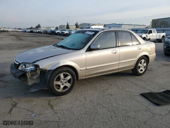 2002 Mazda Protege DX with VIN JM1BJ225621576389, listed as a Copart auction lot 42727745 with 185,042 mi miles and Salvage Title. Bid and sale history available at carsss.com. Image 1.