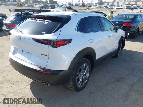 2024 Mazda CX-30 S Premium with VIN 3MVDMBDM4RM616159, listed as a IAAI auction lot 42328334 with 4,614 mi miles and . Bid and sale history available at DreamBid. Image 4.