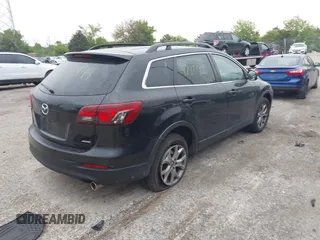 2014 Mazda CX-9 Sport with VIN JM3TB3BV8E0437180, listed as a IAAI auction lot 42413844 with 177,393 mi miles and . Bid and sale history available at DreamBid. Image 4.