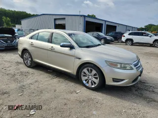 2010 Ford Taurus Limited with VIN 1FAHP2FW7AG138753, listed as a Copart auction lot 64880025 with 242,728 mi miles and Clean title. Bid and sale history available at DreamBid. Image 4.