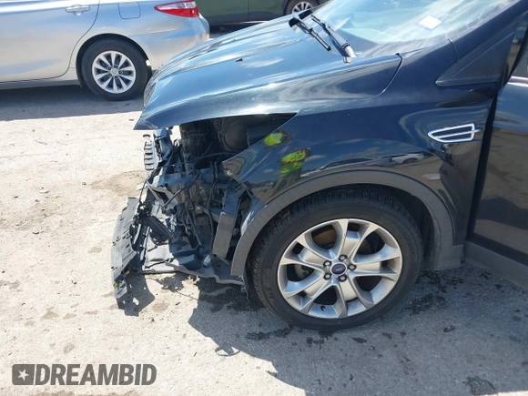 2015 Ford Escape Titanium with VIN 1FMCU0JX3FUB39808, listed as a IAAI auction lot 42212271 with 136,488 mi miles and . Bid and sale history available at DreamBid. Image 6.