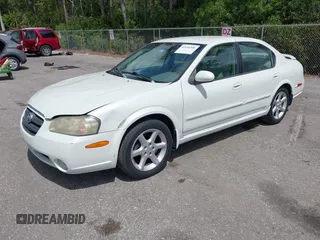 2003 Nissan Maxima SE z VIN JN1DA31DX3T501453, wystawiony jako IAAI lot #42116346 z przebiegiem 127 364 mil mil oraz . Historia ofert i sprzedaży dostępna na DreamBid. Obrazek 2.